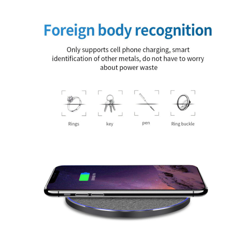 "Minimalist wireless charger with smart foreign object detection text, high-tech safety feature for workspace gadgets, isolated on white."