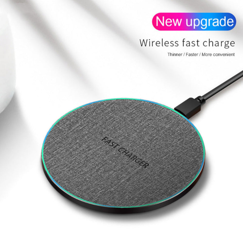 "High-speed wireless charging pad featuring 'New upgrade' promotional text, modern black and white tech accessory isolated on white."