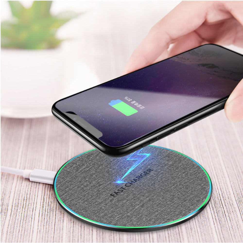 "High-speed wireless charging dock with mobile phone, showing active battery charging status icon, premium workspace accessory."