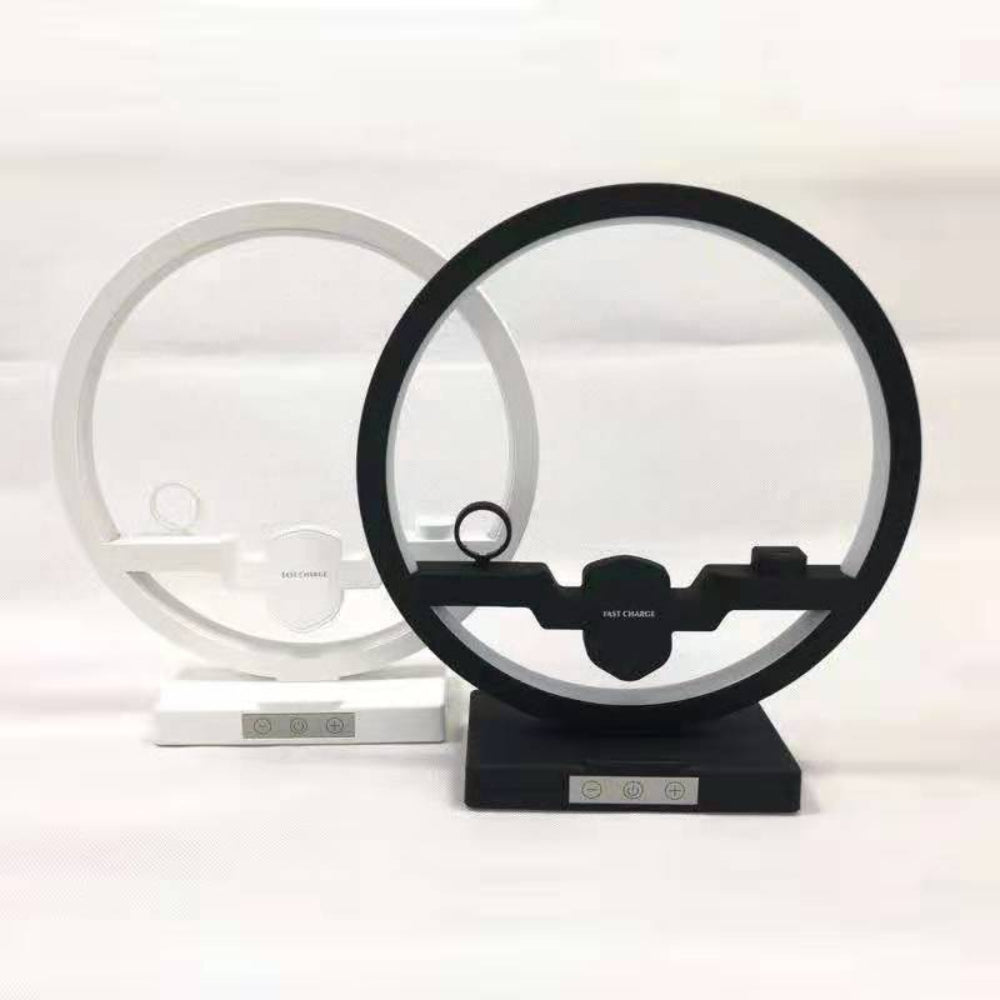 "Two disk-shaped smart devices in black and white finishes, isolated on a white backdrop for a clean product presentation."