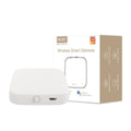 "A sleek white wireless smart gateway hub next to its minimalist product packaging, presented on a clean white background."