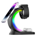 "Sleek black 3-in-1 wireless charging stand on a white background, simultaneously charging a smartphone, a smartwatch, and a pair of wireless earbuds."