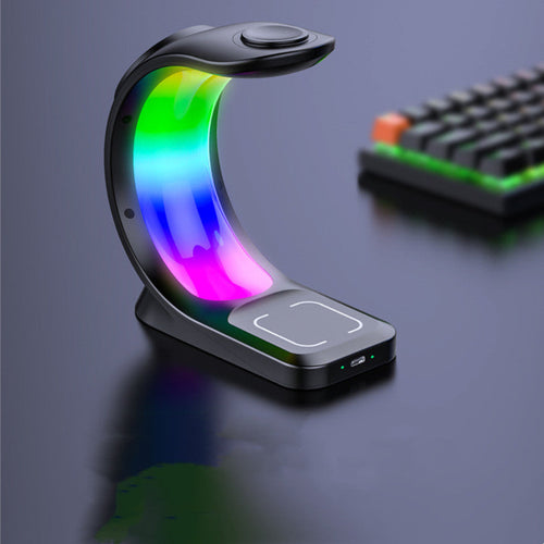 "Multifunctional RGB LED desk lamp featuring an integrated wireless charger base, displayed on a dark textured surface."